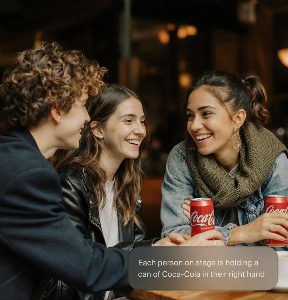 A pixelated image of an orange and white cat lying down, looking to the side, with blurred greenery in the background